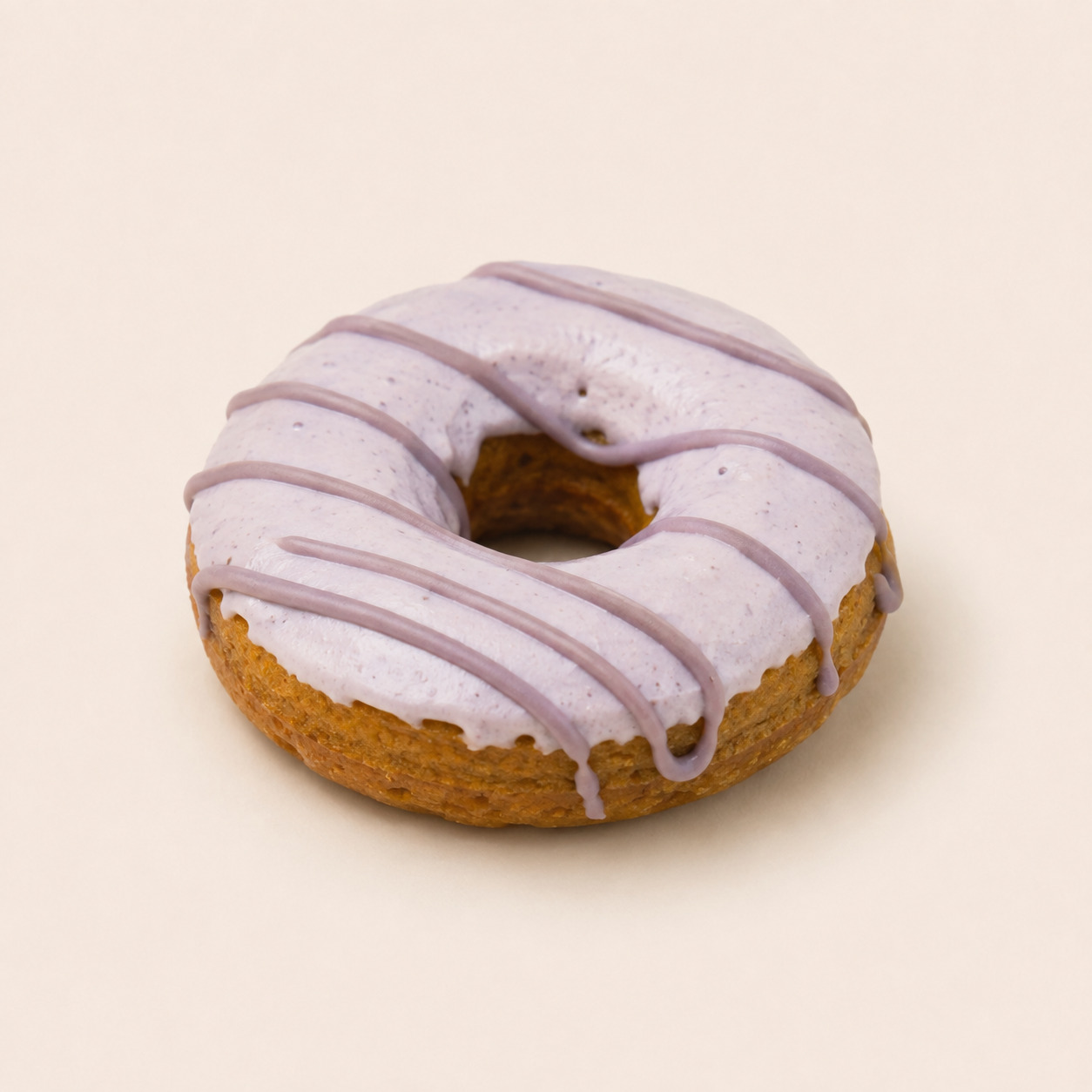 Handmade dog donuts with pale pink icing and drizzle